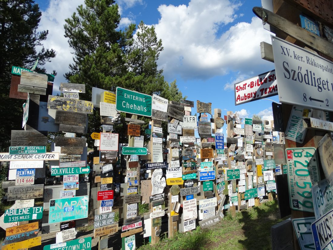 The Signpost Forest in Watson Lake, Yukon, with thousands of signs pointing toward cities around the world