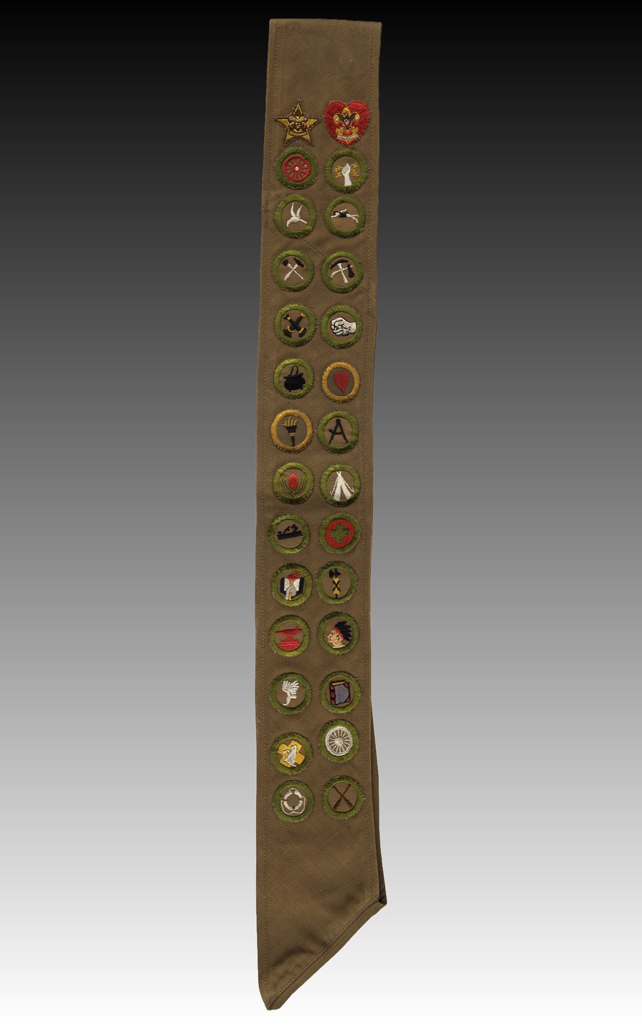 A Boy Scout sash covered in merit badges