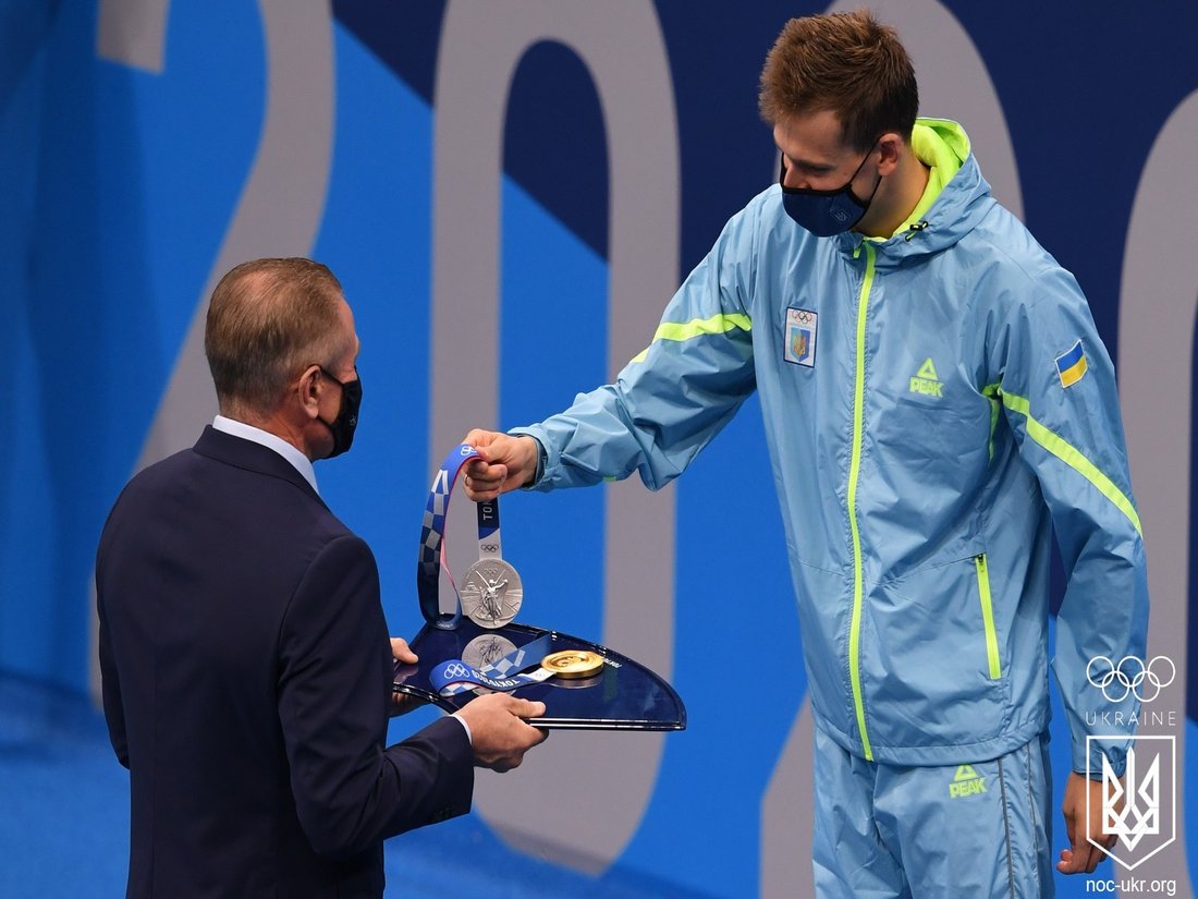 An athlete standing on an Olympic podium