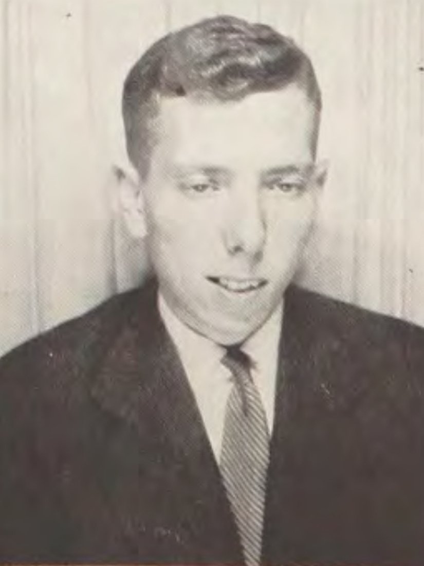 Black-and-white portrait photo of a young Stanley Milgram, 1954